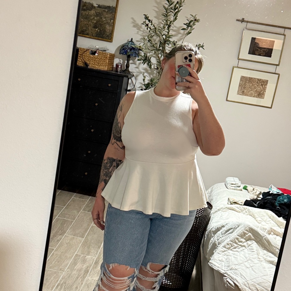Elegant White Sleeveless Peplum Top